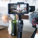 a phone a microphone set up to record a video in a kitchen