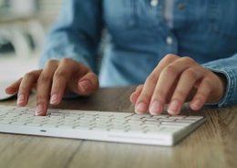 Closeup of woman typing